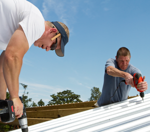 Two Men Working on Roof